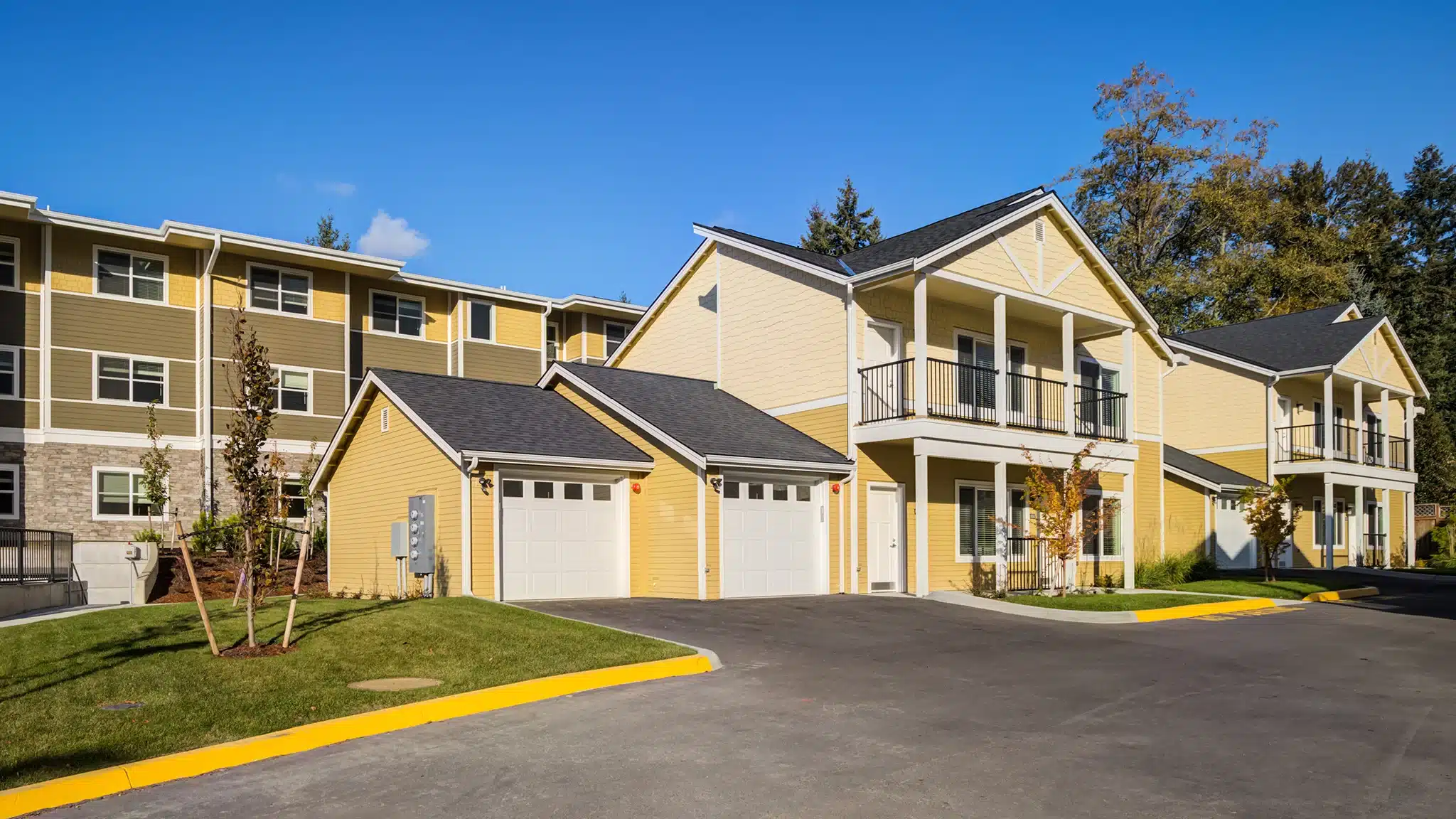 Exterior view of the Mirror Village senior living community with landscaped grounds and residential buildings.